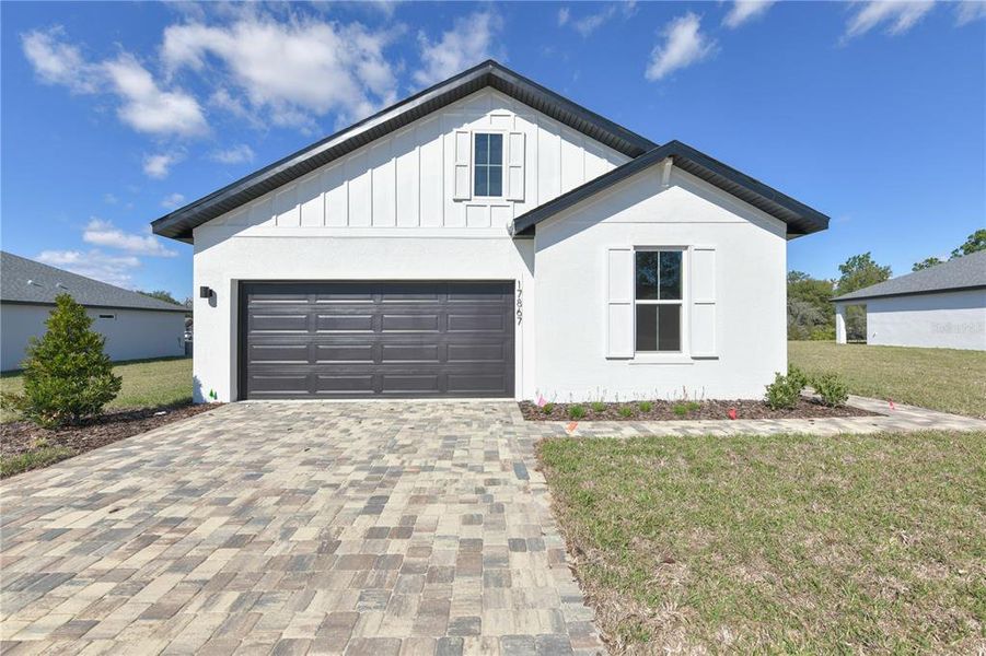 Front exterior of a new home in , Dunnellon, FL, highlighting curb appeal (Image 14).
