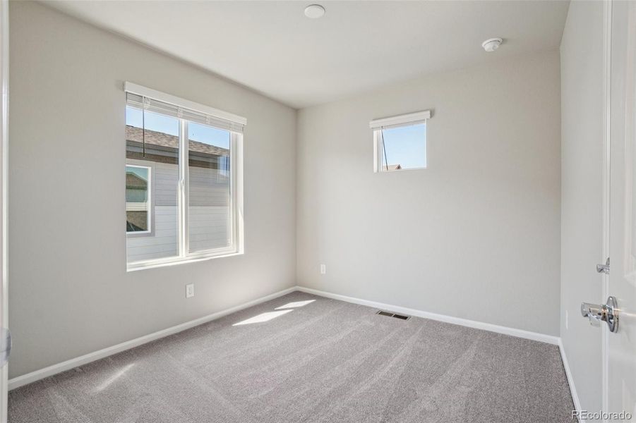 Spacious, unfurnished interior of a new home in Woodrose at Painted Prairie, Aurora (Image 19).