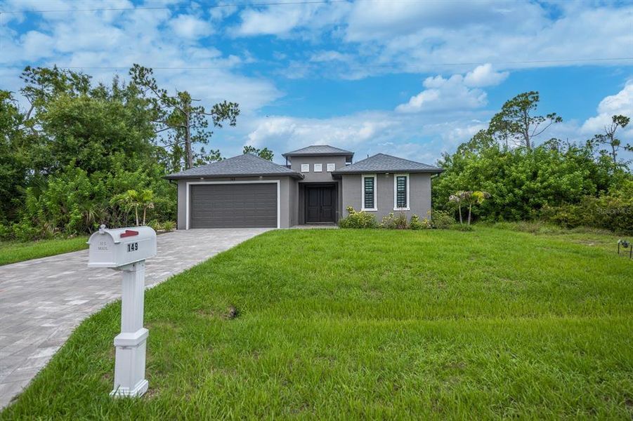 Front exterior of a new home in , Rotonda West, FL, highlighting curb appeal (Image 28). Front exterior of a new home in , Rotonda West, FL, highlighting curb appeal (Image 28).