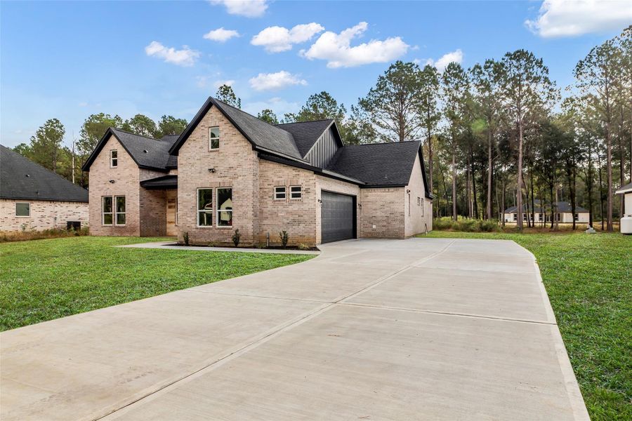 Front exterior of a new home in , Dayton, TX, highlighting curb appeal (Image 25). Front exterior of a new home in , Dayton, TX, highlighting curb appeal (Image 25).