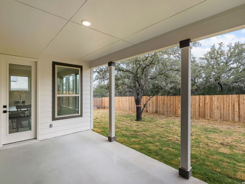 Exterior details and patio area of a home in The Reserve at Potranco Oaks, Castroville (Image 33).