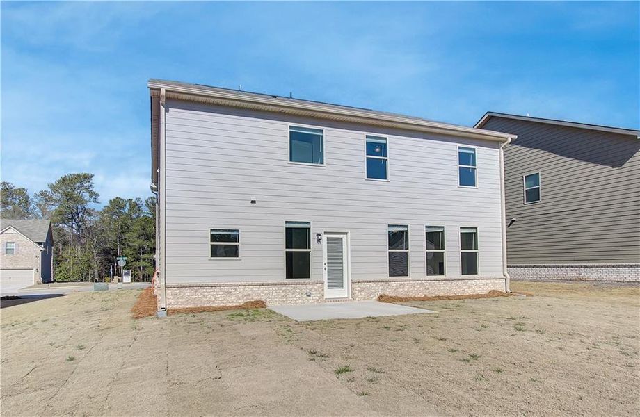 Front exterior of a new home in Cedar Grove Commons, Conley, GA, highlighting curb appeal (Image 12). Front exterior of a new home in Cedar Grove Commons, Conley, GA, highlighting curb appeal (Image 12).