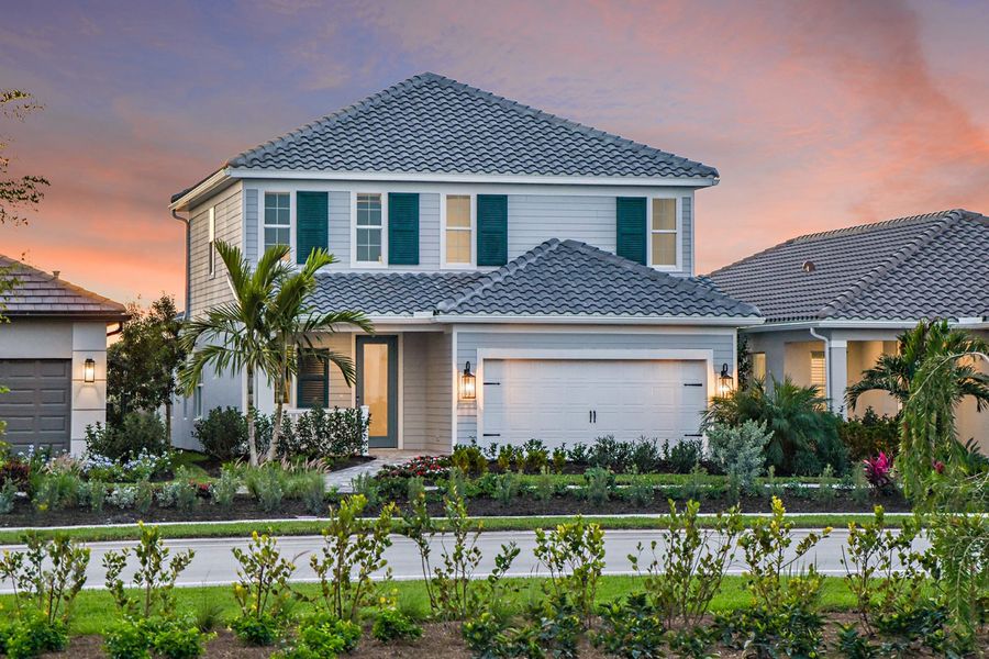 Representative exterior photo of a completed home built from the Heritage by Neal Communities in SkySail, Naples, FL (Image 18).