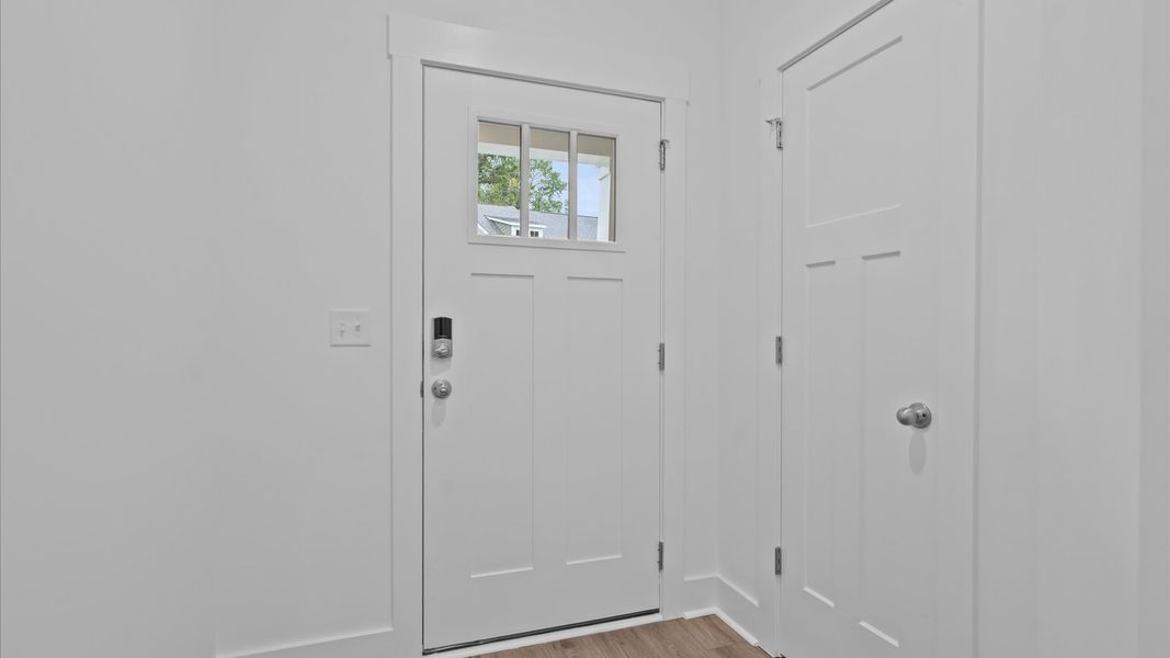 Superior design begins at the front door with a hardwood floor foyer and elegant sightlines Superior design begins at the front door with a hardwood floor foyer and elegant sightlines