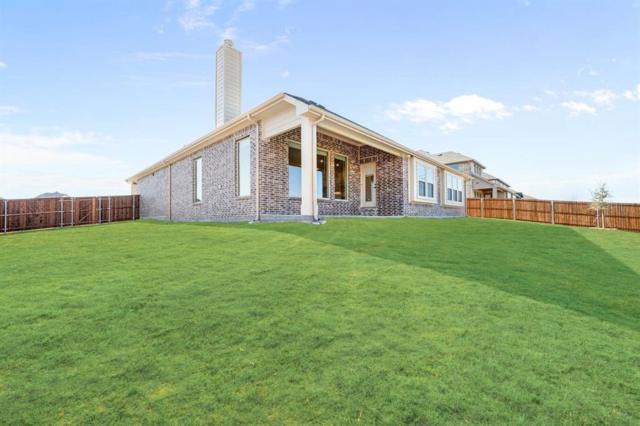 Exterior details and patio area of a home in Villages of Hurricane Creek, Anna (Image 29).