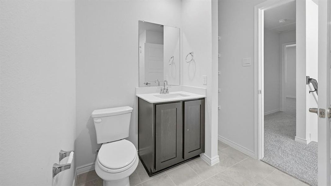 Bathroom with vanity and light tile patterned floors
