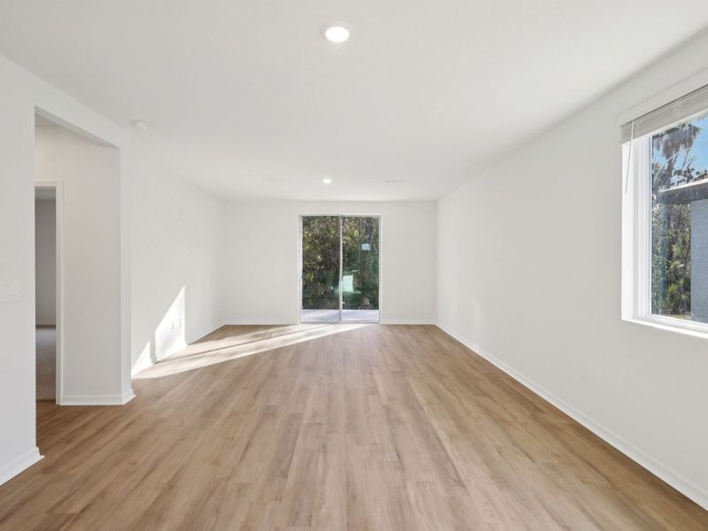 Spacious, unfurnished interior of a new home in The Grove at Stuart Crossing - Premier Series, Bartow (Image 7).