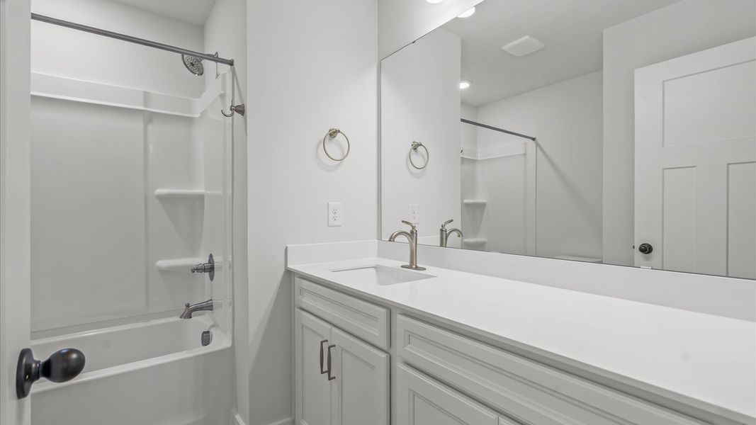 Top-notch bathroom with current fixtures, tasteful materials, and elevated charm