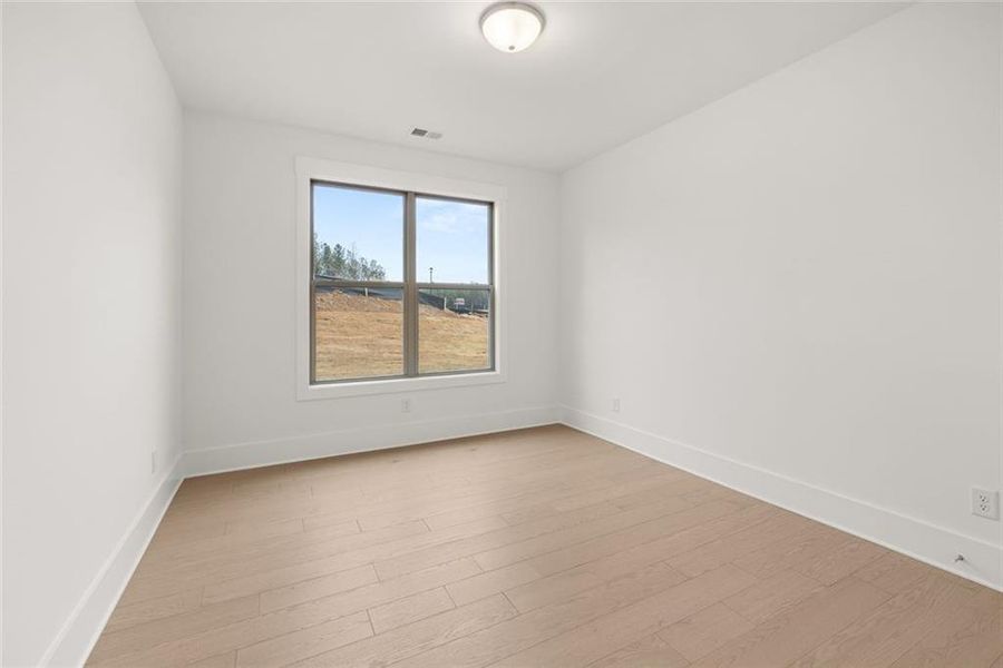 Spacious, unfurnished interior of a new home in Soleil Belmont Park, Canton (Image 41).
