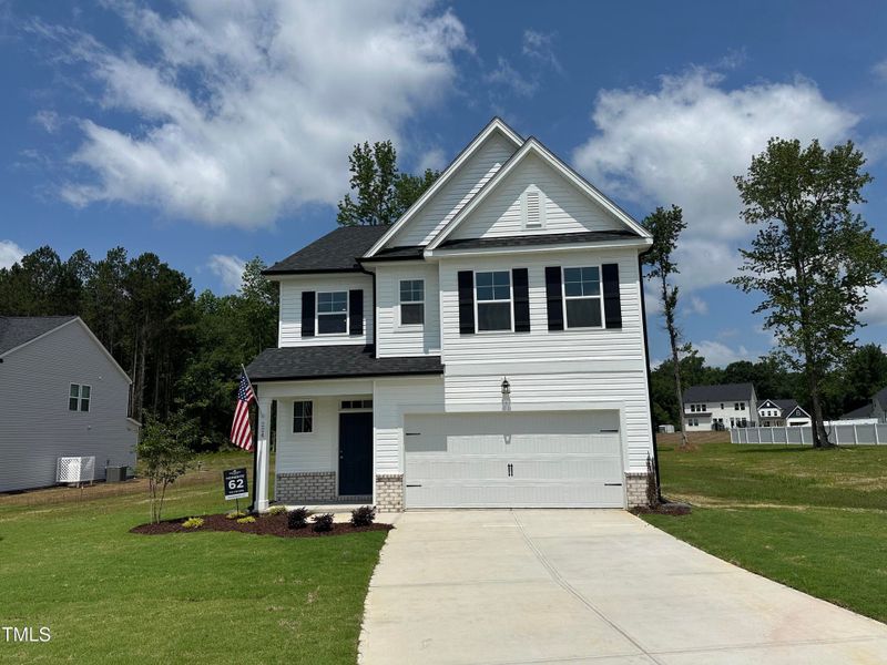 Front exterior of a new home in Wellers Knoll, Lillington, NC, highlighting curb appeal (Image 11).