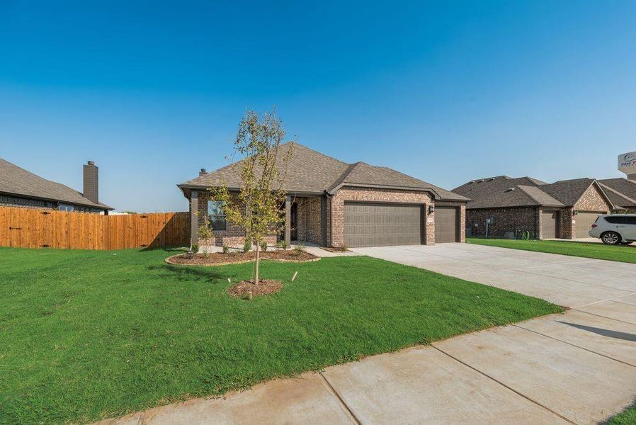 Front exterior of a new home in , Pilot Point, TX, highlighting curb appeal (Image 1). Front exterior of a new home in , Pilot Point, TX, highlighting curb appeal (Image 1).