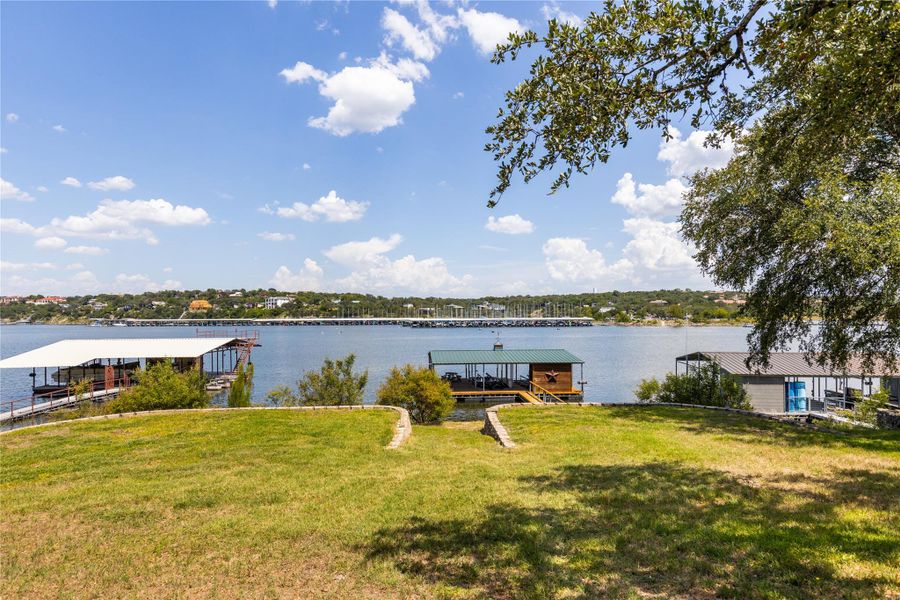 Water view with a boat dock and boat lift
