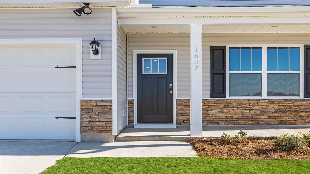 Exterior details and patio area of a home in Durbin Meadows Traditions, Fountain Inn (Image 2). Exterior details and patio area of a home in Durbin Meadows Traditions, Fountain Inn (Image 2).