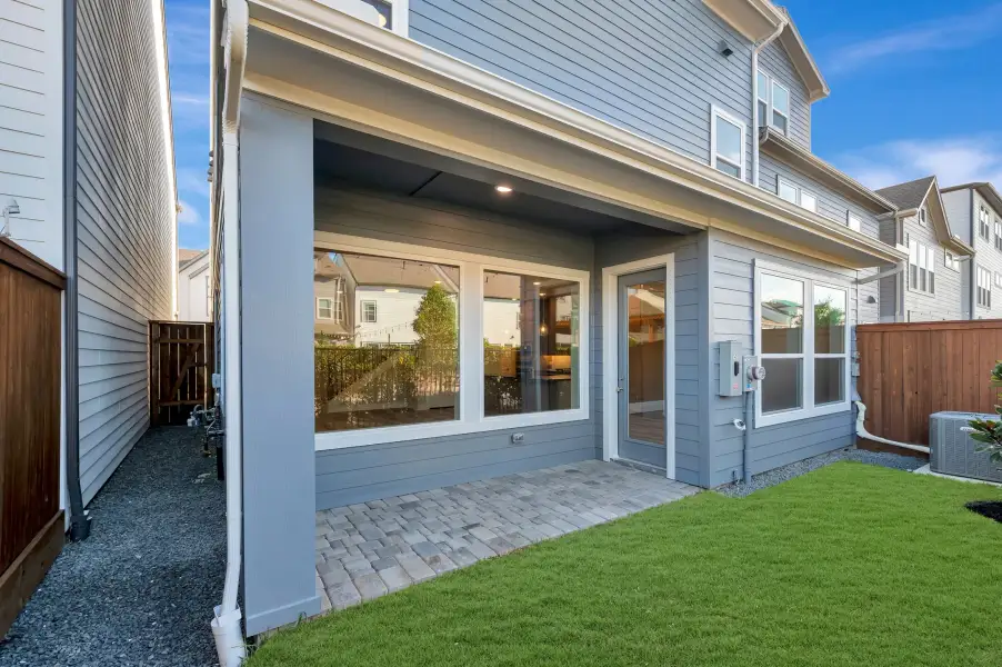 Exterior details and patio area of a home in Retreat at Oak Park, Houston (Image 3).