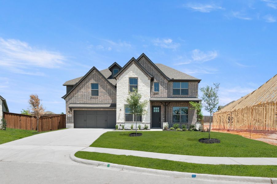 Front exterior of a new home in Redden Farms, Midlothian, TX, highlighting curb appeal (Image 1). Front exterior of a new home in Redden Farms, Midlothian, TX, highlighting curb appeal (Image 1).