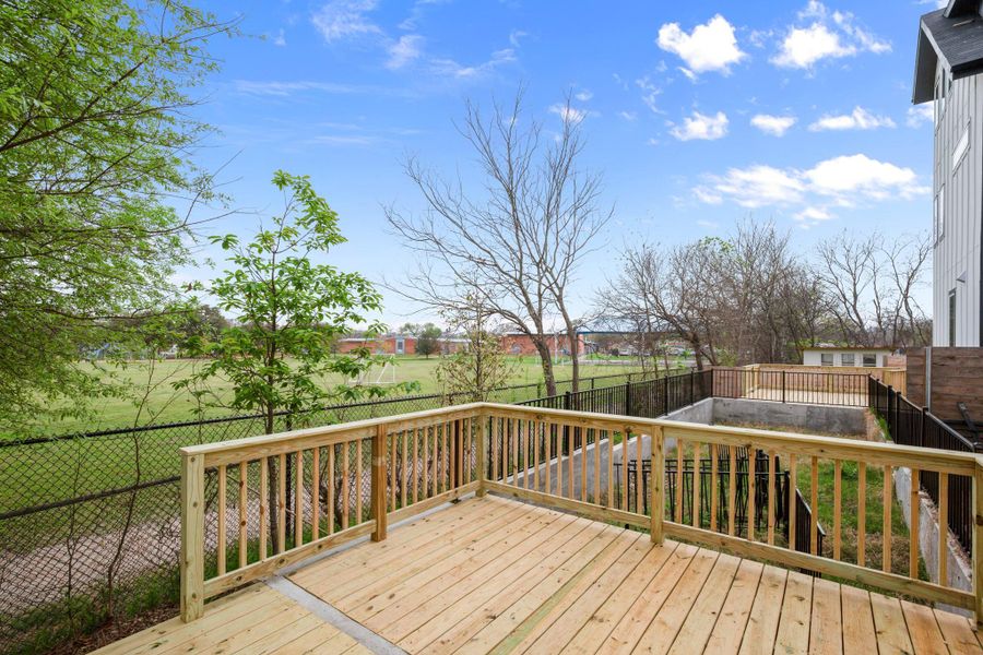 Wooden deck featuring a fenced backyard