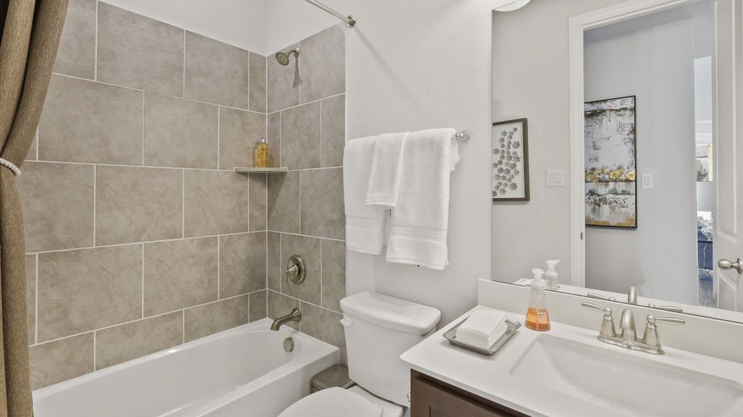 Representative furnished interior of a home built from the Hickory by Brightland Homes in Sunterra, Katy (Image 13).