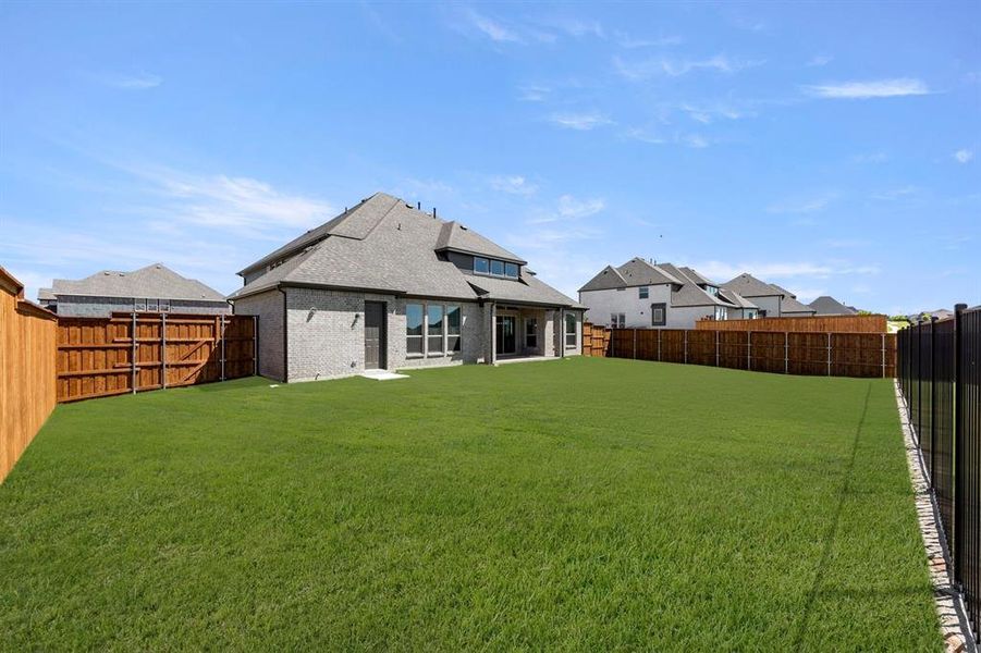Exterior details and patio area of a home in Cambridge Estates - Harwood, Prosper (Image 4).