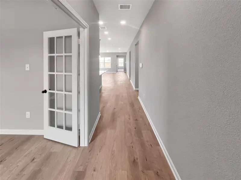 The Oakshire II- Foyer and Study with French Doors. Home under construction.  Sample image for illustration; upgrades, options, and colors may vary.