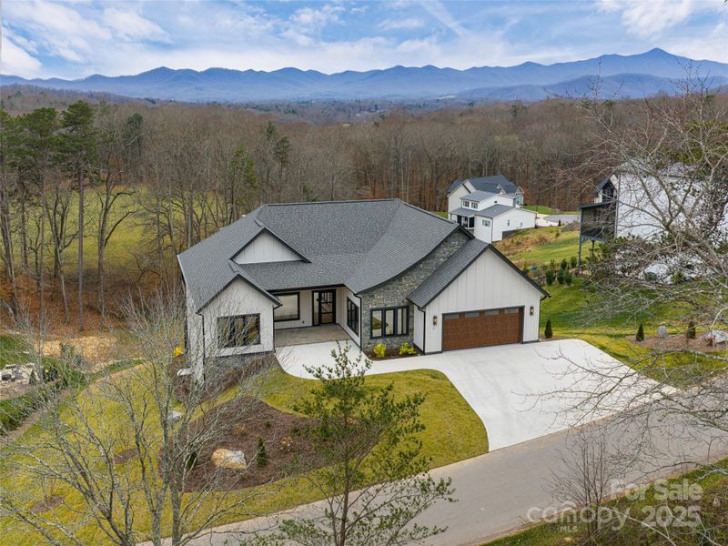 Front exterior of a new home in , Candler, NC, highlighting curb appeal (Image 25). Front exterior of a new home in , Candler, NC, highlighting curb appeal (Image 25).