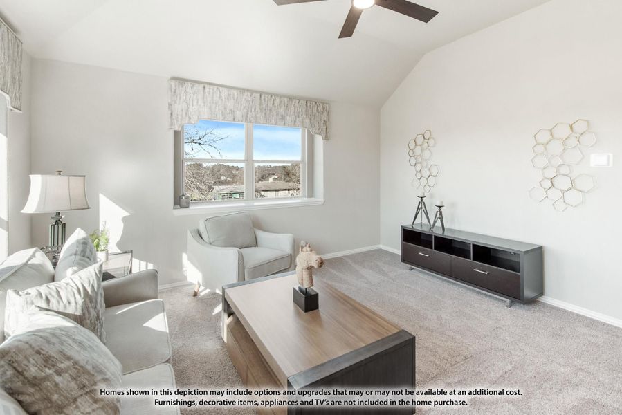Living room with vaulted ceiling, ceiling fan, carpet flooring, and a large window with natural light