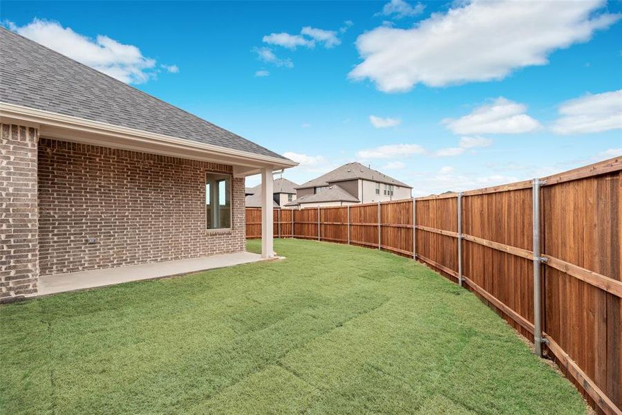 Exterior details and patio area of a home in Villages of Creekwood, Frisco (Image 19).