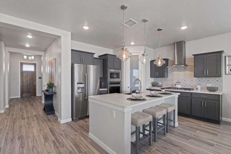 Representative furnished interior of a home built from the Valencia by Hakes Brothers in Hillside Park, El Paso (Image 7).