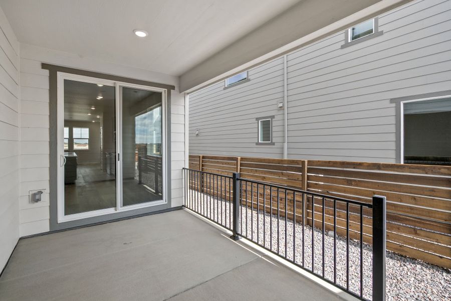 Exterior details and patio area of a home in Barefoot Village, Firestone (Image 3).
