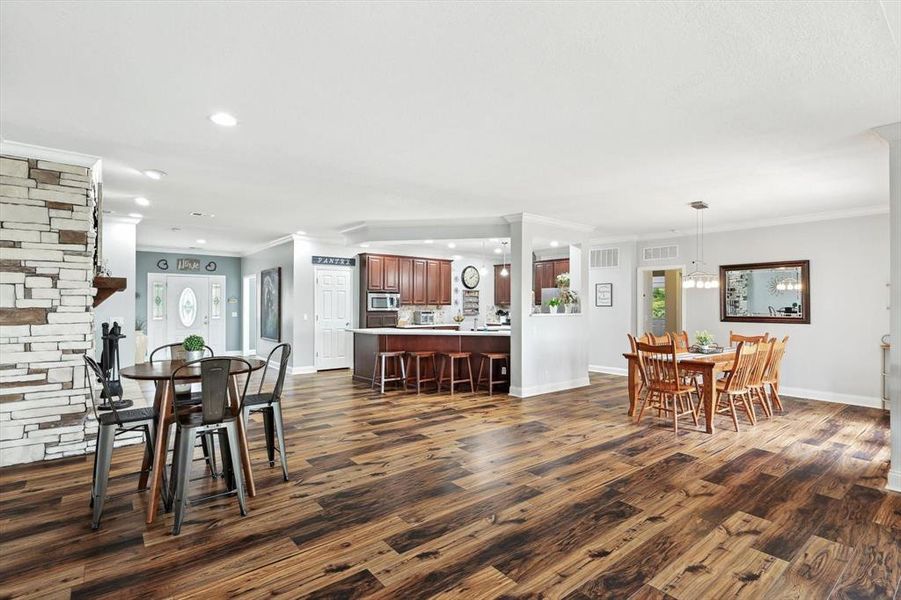 Dining room featuring crown molding and dark hardwood / wood-style floors