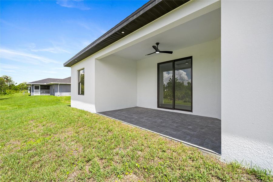 Front exterior of a new home in , Lehigh Acres, FL, highlighting curb appeal (Image 24).