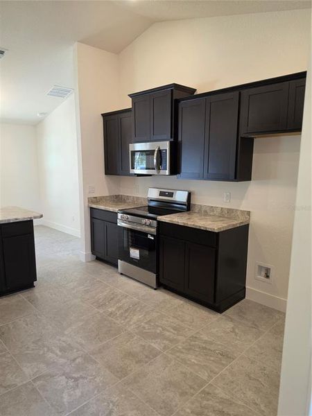 Furnished interior view inside a new home in Royal Highlands, Weeki Wachee (Image 9).