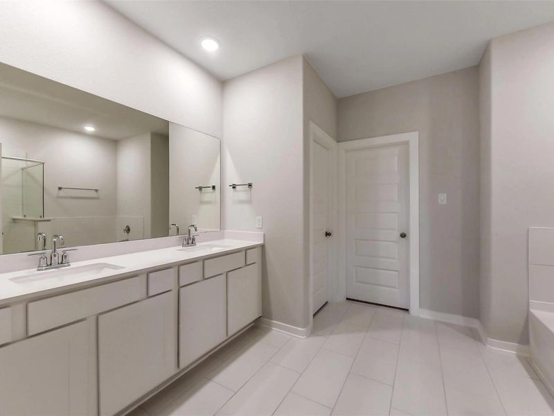 Furnished interior view inside a new home in Sunterra, Katy (Image 14).