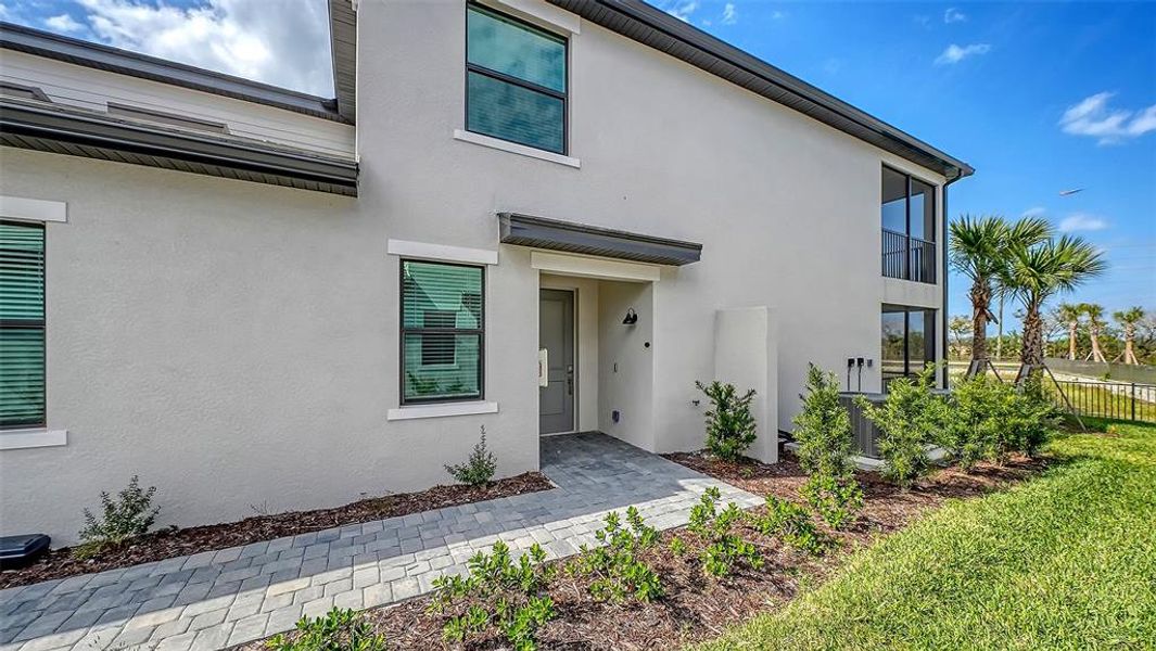 Exterior details and patio area of a home in Legends Cove, Bradenton (Image 3).