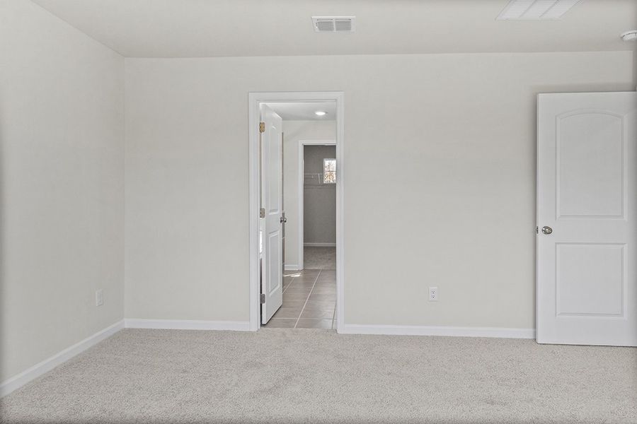 A hallway with white doors. A hallway with white doors.