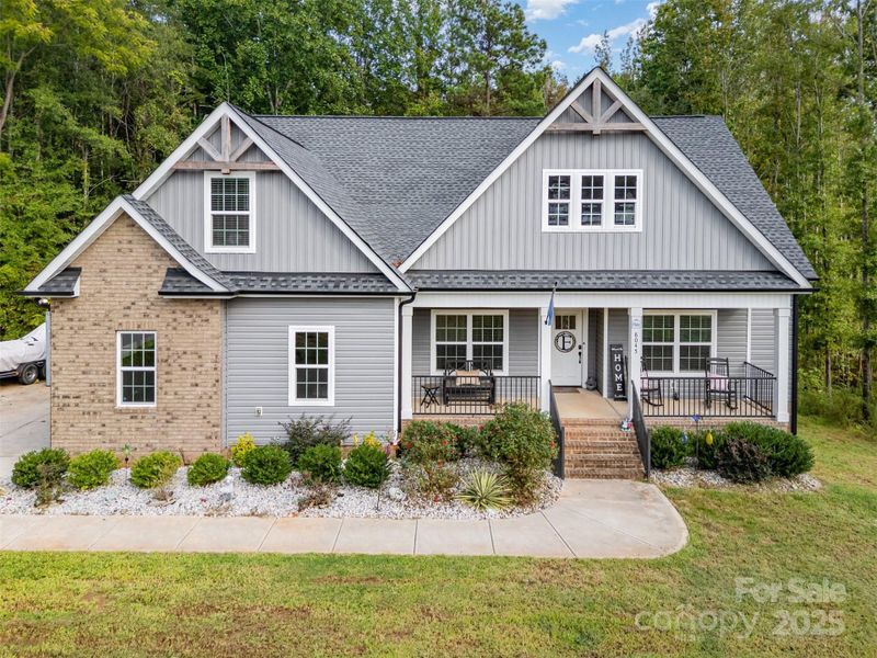 Front exterior of a new home in , Clover, SC, highlighting curb appeal (Image 26).