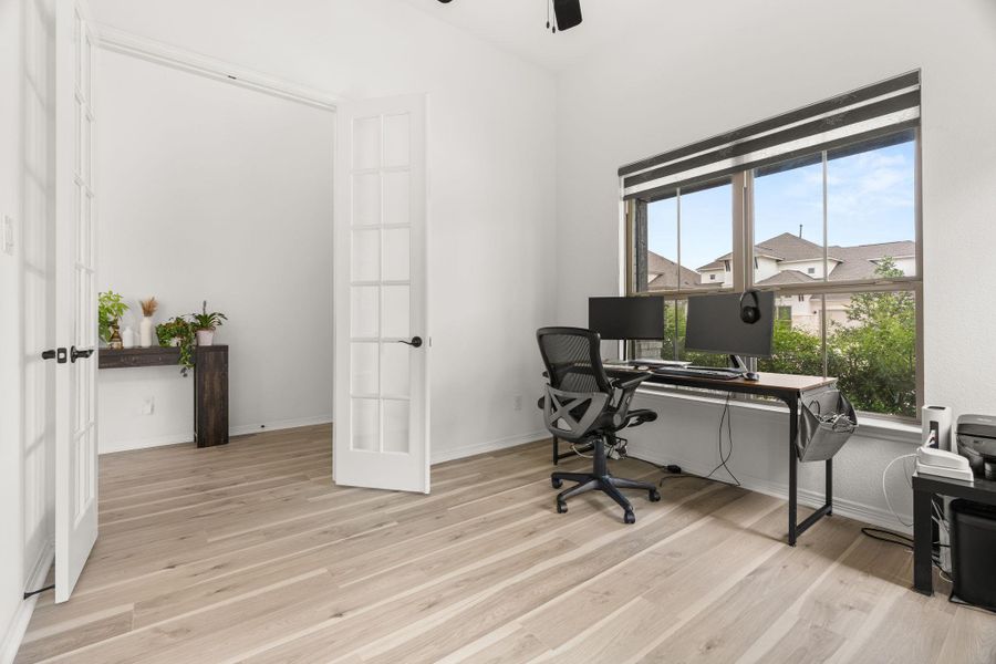 Natural light floods this versatile home office, complete with light wood flooring and a view of the neighborhood. Natural light floods this versatile home office, complete with light wood flooring and a view of the neighborhood.