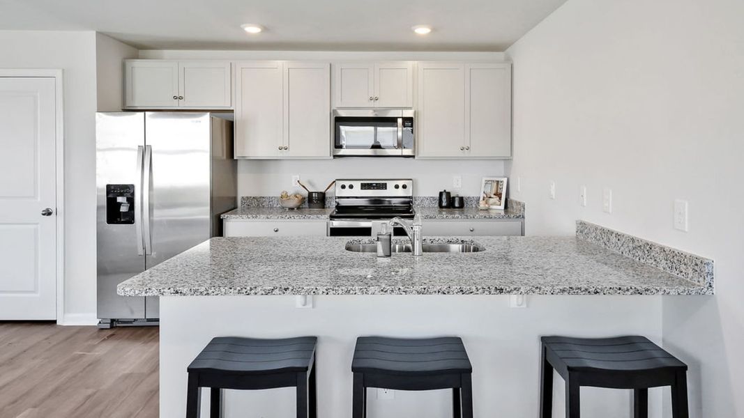 Representative furnished interior of a home built from the MITCHELL TOWNHOME by D.R. Horton in Grayson Park Townhomes, Leland (Image 12). Representative furnished interior of a home built from the MITCHELL TOWNHOME by D.R. Horton in Grayson Park Townhomes, Leland (Image 12).