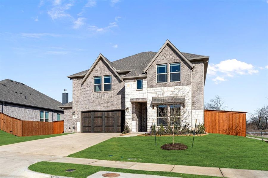 Front exterior of a new home in The Grove, Midlothian, TX, highlighting curb appeal (Image 2).