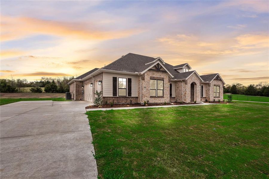 Front exterior of a new home in King Crossing Estates, Van Alstyne, TX, highlighting curb appeal (Image 25).