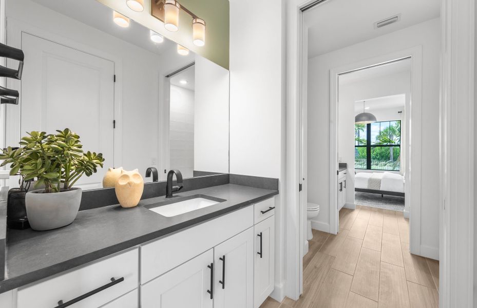 Additional view of Jack and Jill style bathroom with private sinks