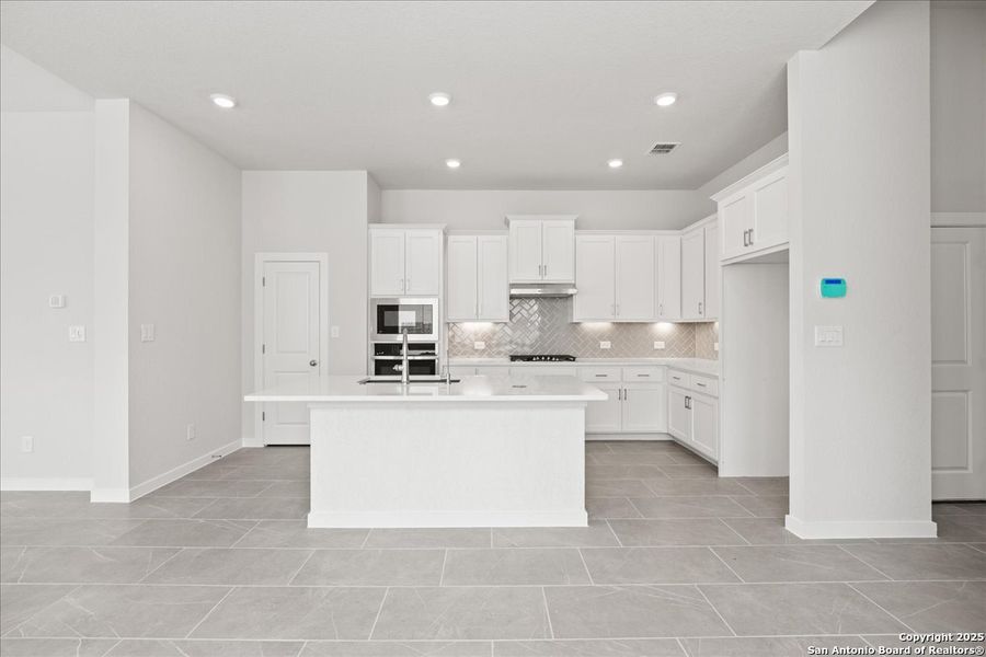 Furnished interior view inside a new home in Village at Three Oaks, Seguin (Image 6).