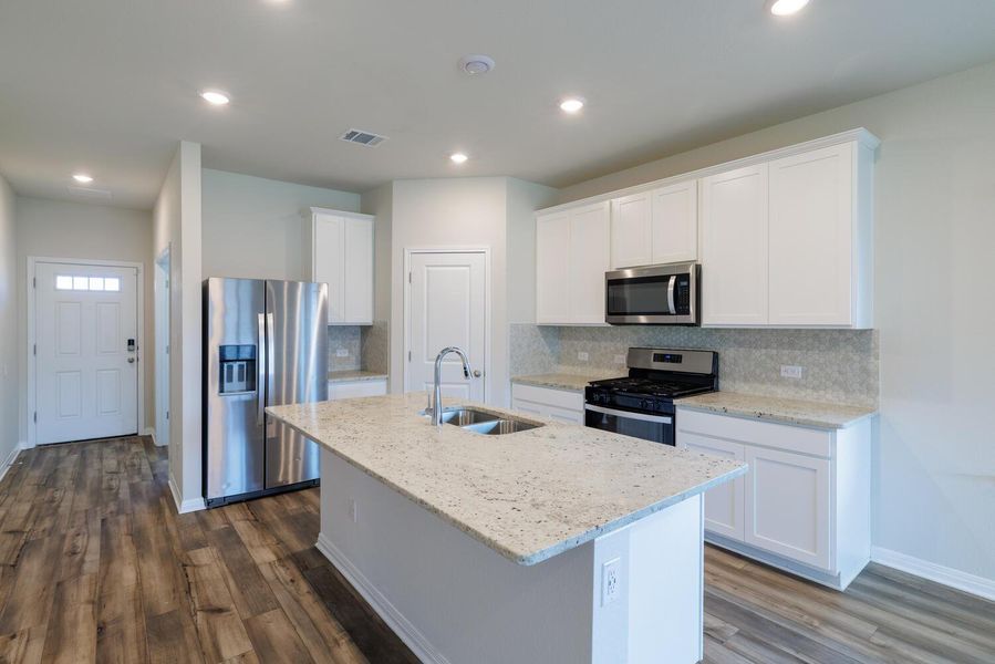 Furnished interior view inside a new home in , Manor (Image 6).