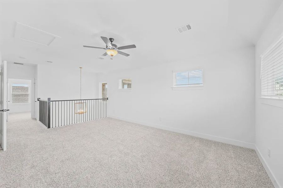 Representative unfurnished interior of a home built from the Madison by Chesmar Homes in Grange, Katy (Image 26).