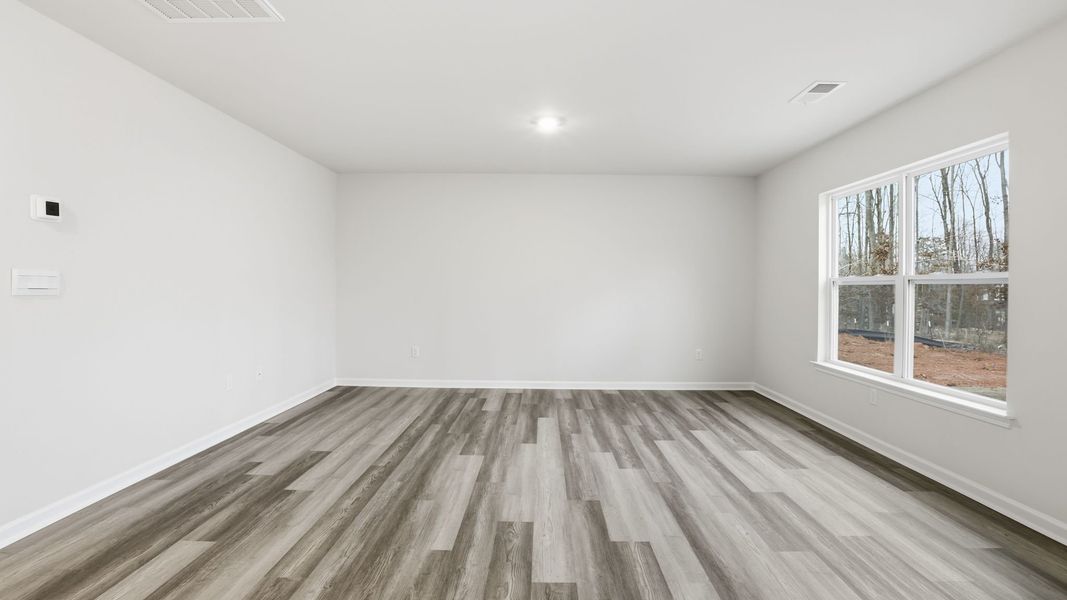 Spacious, unfurnished interior of a new home in Bentley Park, Greenwood (Image 22).