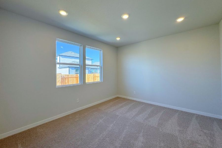 A room with a window and a carpet. A room with a window and a carpet.