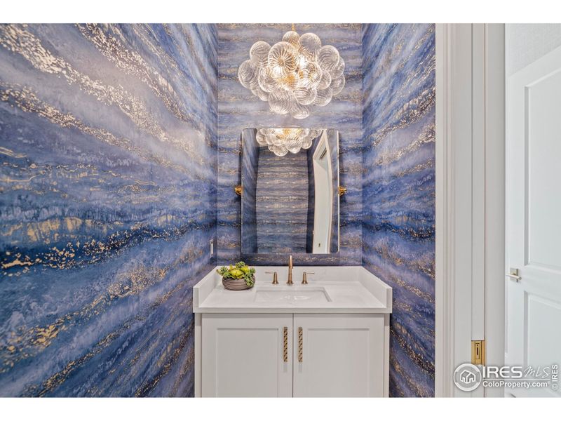 Powder baths throughout feature soapstone, quartz, under cabinet/custom lighting, and wallpaper