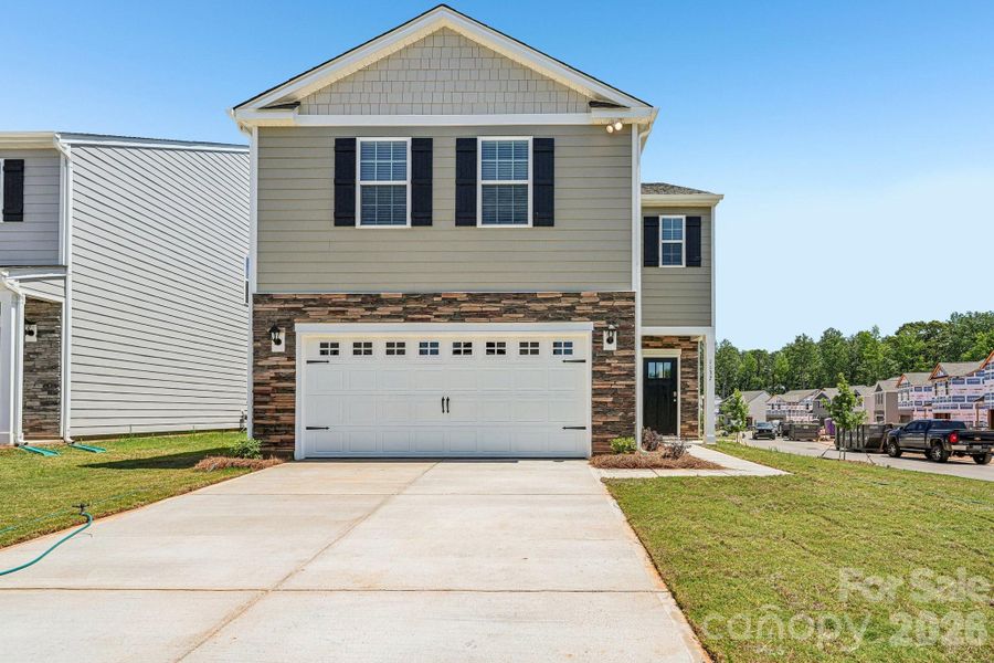 Front exterior of a new home in Fergus Crossing, York, SC, highlighting curb appeal (Image 2). Front exterior of a new home in Fergus Crossing, York, SC, highlighting curb appeal (Image 2).