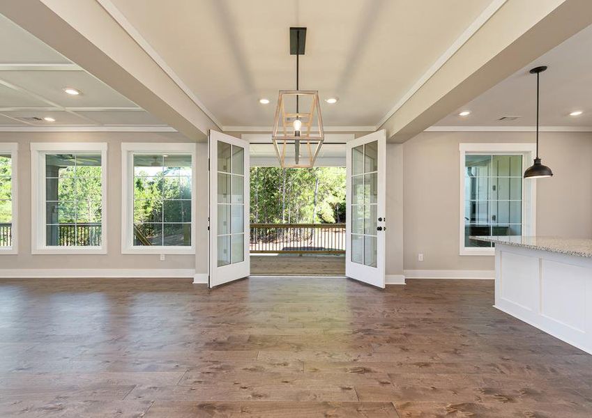 Dining area off the kitchen with wood floors.