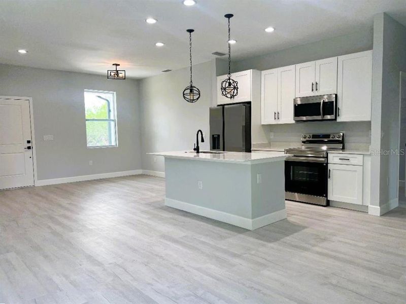 View of Entrance, Kitchen & Dining Areas!