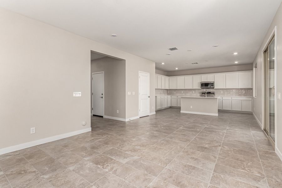 Spacious, unfurnished interior of a new home in Bentridge – Canyon Series, Buckeye (Image 6). Spacious, unfurnished interior of a new home in Bentridge – Canyon Series, Buckeye (Image 6).